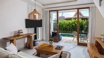 Standard Villa | Living area | 43-inch Smart TV with digital channels, TV, pay movies