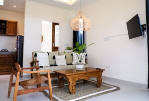 Standard Villa | Living area | 43-inch Smart TV with digital channels, TV, pay movies