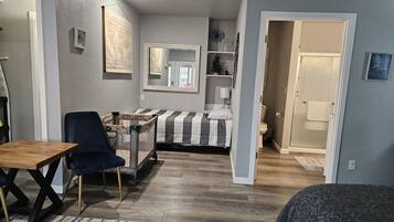 1 bedroom, desk, iron/ironing board, travel crib