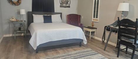 1 bedroom, desk, iron/ironing board, travel crib