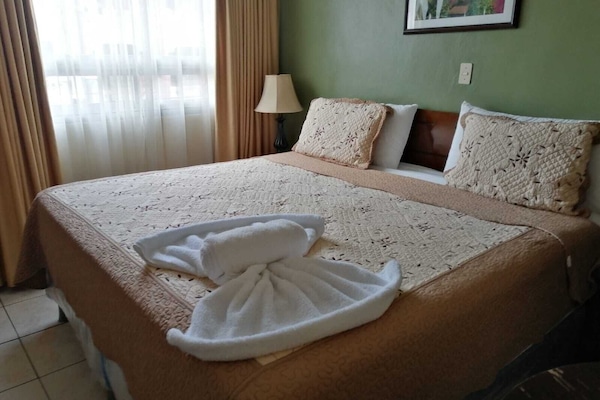 Classic Single Room, 1 Twin Bed, Private Bathroom | Down comforters, desk, blackout drapes, iron/ironing board