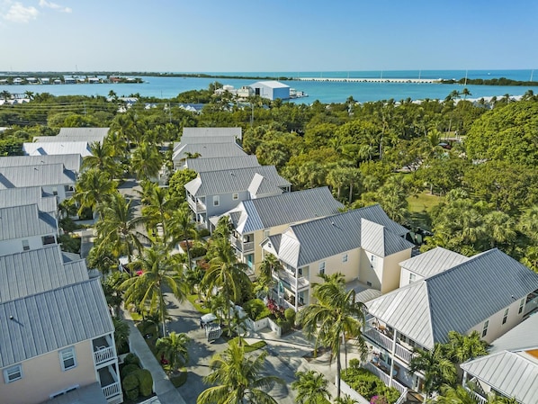 A resort with multiple-story buildings, a marina, and a pier extending into the water. - Private Pool Oasis - Centrally Located in Florida Keys (Duck Key)