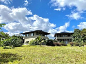 Set amidst a serene natural setting, this two-story building offers a peaceful retreat.