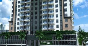 A high-rise residential building with multiple balconies, a sign reading "PANORAMA 310," and a gated entrance with palm trees. - Luxury Condo 1 Br Pool Excellent Location (Santo Domingo)