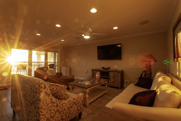 Enjoy the sunrise over the ocean from the living room.