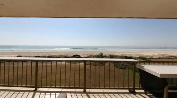 Enjoy the serene ocean view from this balcony.