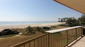 Enjoy breathtaking views of the beach from this balcony.