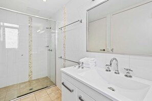 Shower, hair dryer, towels, shampoo