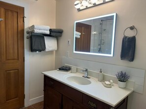 Shower, hair dryer, towels, soap