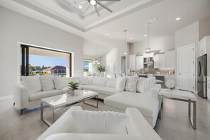 TV - TRUE LUXURY! Brand New Home with Heated Pool, Kayaks. - Villa Luxuria Blanca - Roelens Vacations (Cape Coral)