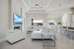 TV - TRUE LUXURY! Brand New Home with Heated Pool, Kayaks. - Villa Luxuria Blanca - Roelens Vacations (Cape Coral)
