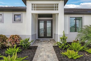 Exterior detail - TRUE LUXURY! Brand New Home with Heated Pool, Kayaks. - Villa Luxuria Blanca - Roelens Vacations (Cape Coral)