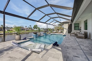 A heated pool - TRUE LUXURY! Brand New Home with Heated Pool, Kayaks. - Villa Luxuria Blanca - Roelens Vacations (Cape Coral)