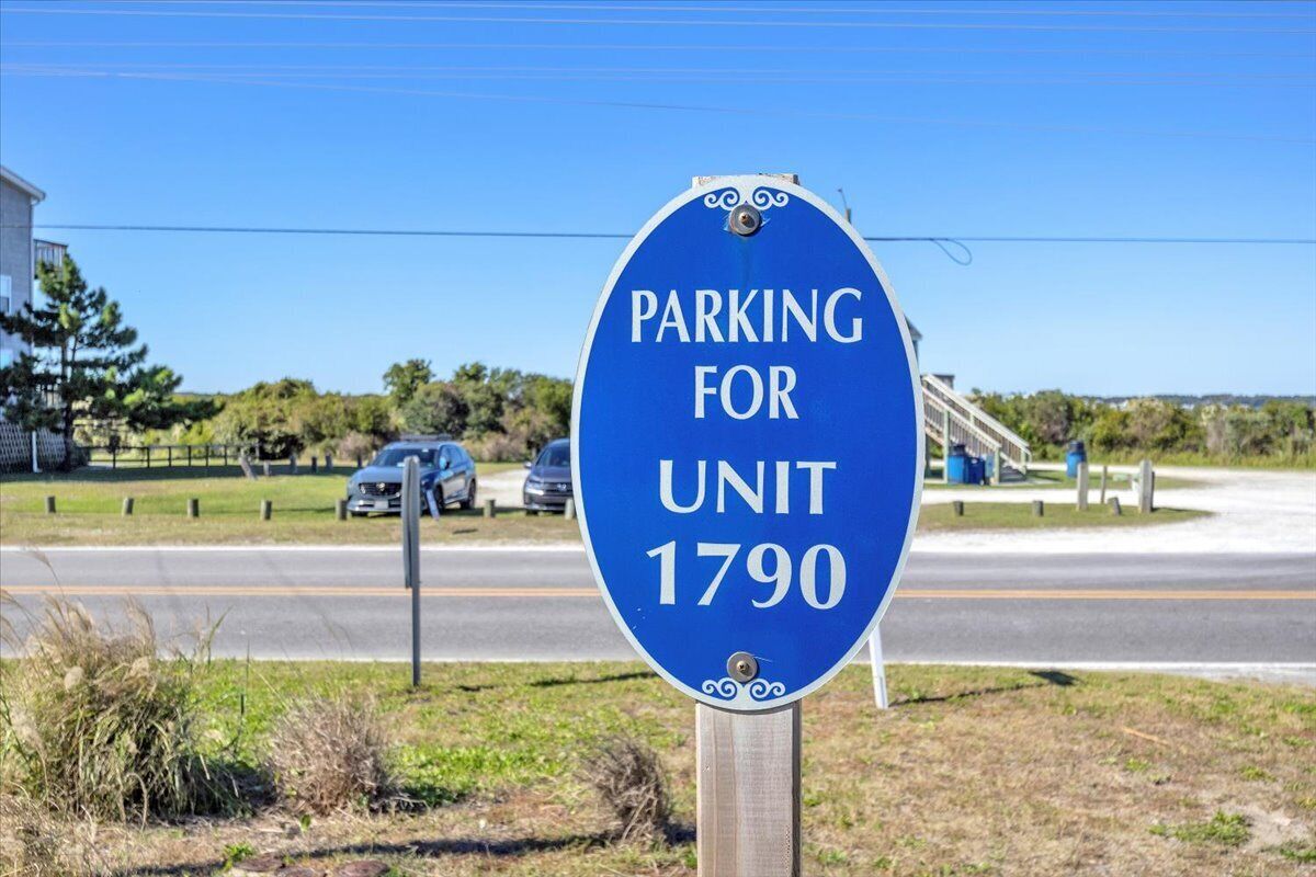 A blue parking sign for Unit 1790.