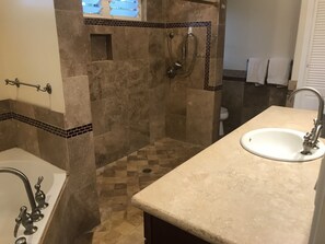 Shower, jetted bath, towels, soap