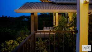 A modern building with a metal roof and a balcony. - Karawwa Luxury Villas  (Hikkaduwa)
