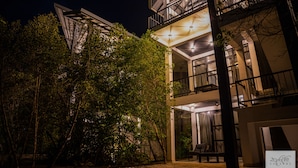 A modern building with multiple balconies and a well-lit entrance. - Karawwa Luxury Villas  (Hikkaduwa)