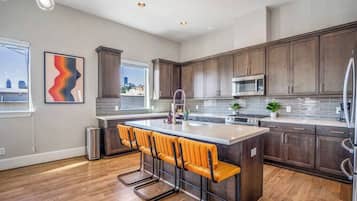 Fridge, coffee/tea maker, cookware/dishes/utensils