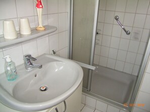 Combined shower/bathtub, hair dryer, soap