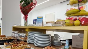 A buffet setup with various food items, including fruits, cheeses, and meats. - Hotel Arte Mare (San Vito Lo Capo)