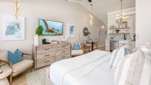 A modern bedroom with a bed, a desk, and a ceiling fan. - Napili Shores A202 Of Studio 1 Bedroom Condo by RedAwning (Lahaina)