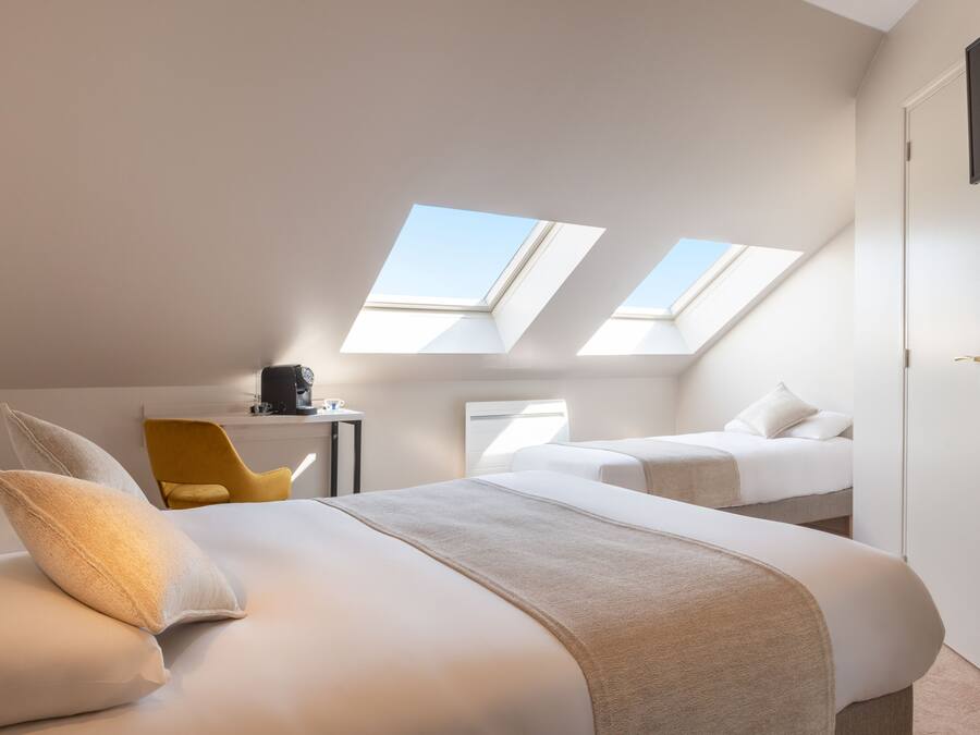 Chambre Triple Deluxe | Rideaux occultants, chambres insonorisées, fer et planche à repasser