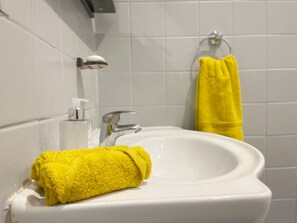 Hair dryer, towels, soap, shampoo