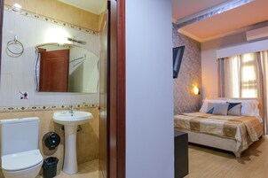Shower, hair dryer, slippers, towels