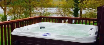 Elevated Loch View Cabin with WiFi, Electric Hot Tub and Mountain Views