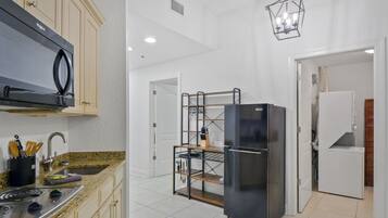 Fridge, microwave, stovetop, coffee/tea maker