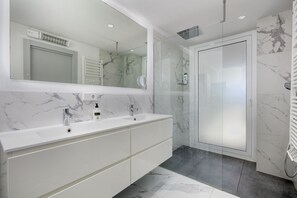 Shower, hair dryer, towels, soap