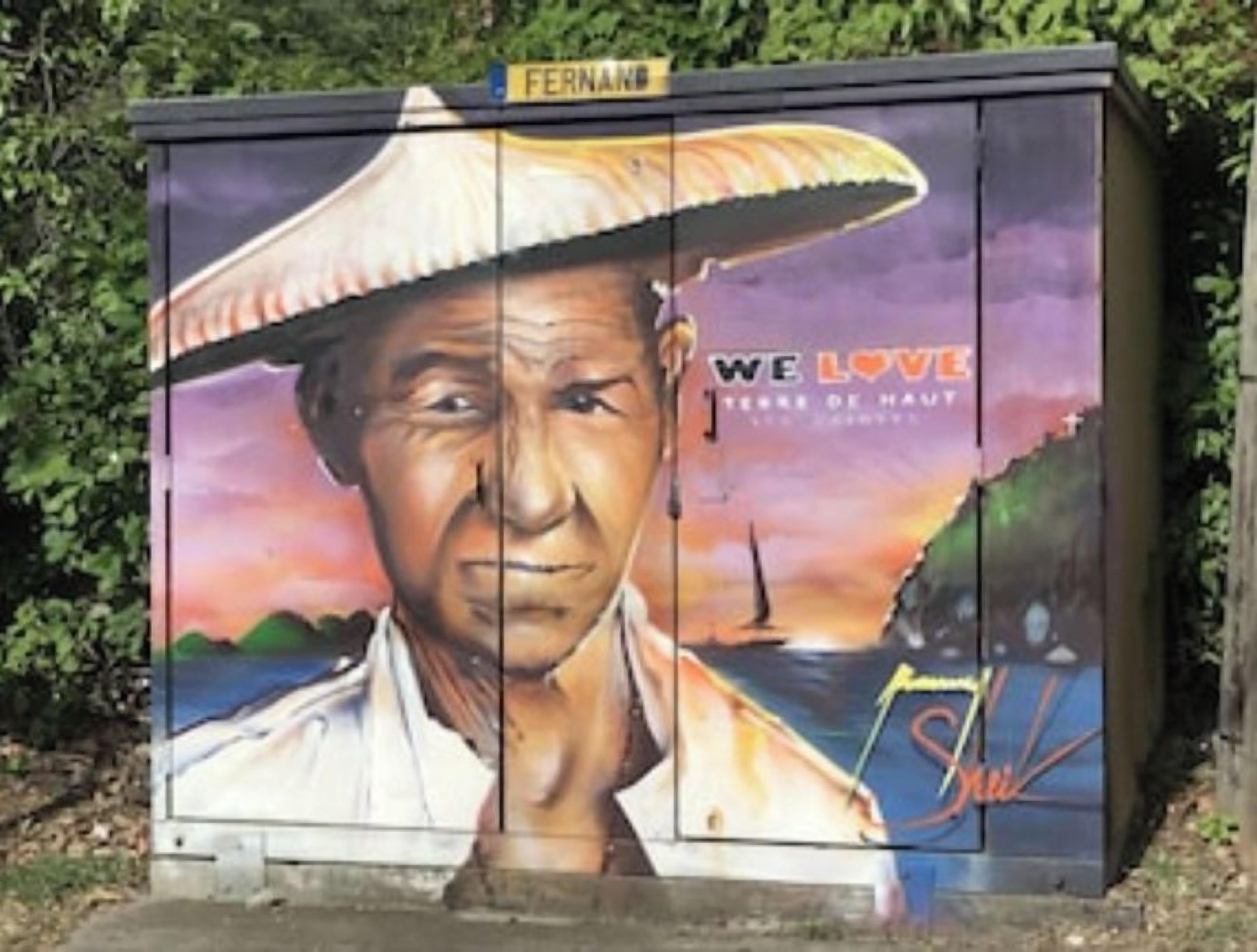 A mural with a person wearing a hat, a sunset, and the text "WE LOVE".