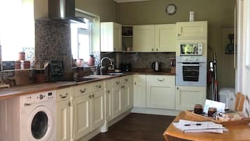 Microwave, oven, dishwasher, dining tables