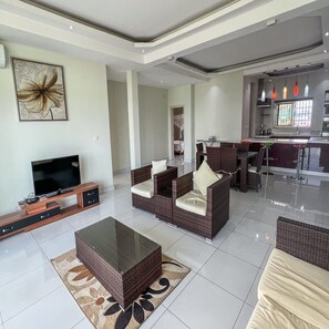 Luxury Apartment, 3 Bedrooms | Living area | 43-cm flat-screen TV with satellite channels, TV - Paradise appartment hotel (Bujumbura)