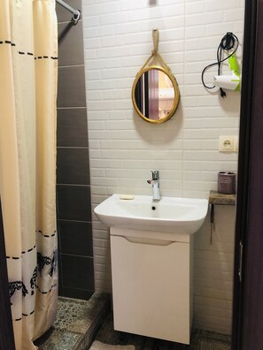 Shower, hair dryer, soap, shampoo