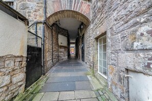 Stroll through this charming alleyway lined with historic stone buildings.