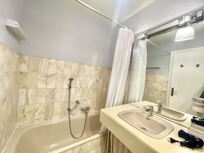 Bathtub, hair dryer, towels