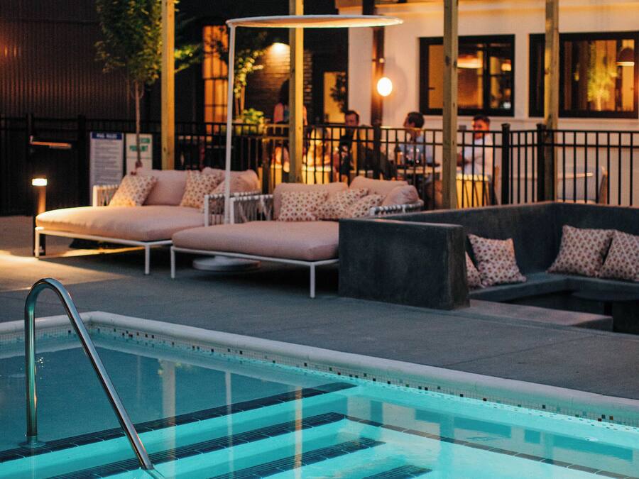 Outdoor pool, open 9:00 AM to 10:00 PM, free cabanas, pool umbrellas