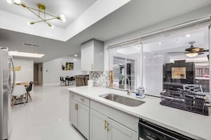 Fridge, microwave, oven, stovetop - Luxurious Home with Pool, Grill, Sauna & Game Room (The Colony)
