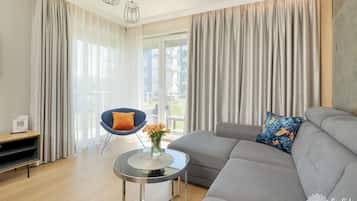 Premium Apartment, 1 Queen Bed with Sofa bed, Non Smoking, Bathtub | Living area | 50-inch plasma TV with satellite channels, TV