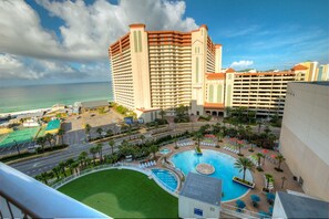 Enjoy ocean views from the hotel's spacious balconies, with a resort-like pool area featuring sun loungers and umbrellas.