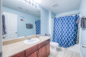 Combined shower/tub, hair dryer, towels, soap