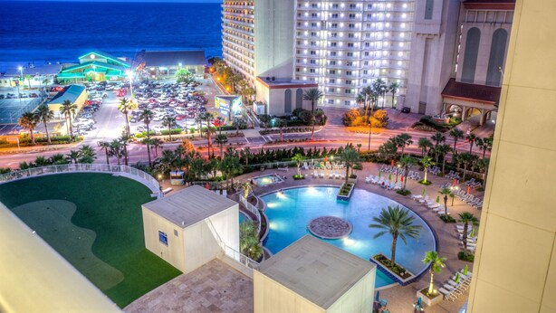 A resort with a large pool, multiple buildings, and a view of the ocean. - Exceptional unit! Extra large offering the best set up and views! (Panama City Beach)