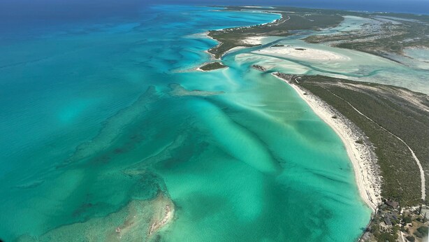 An aerial view of a coastal area with clear turquoise waters, sandy beaches, and dense vegetation. - New Private Pool, Private Beach and Flat, Private House, what else do you need? (Whymms)
