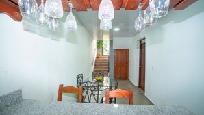 A dining area with a glass table, chairs, and hanging crystal chandeliers. - RIVER VIEW / VILLA FRENTE AL RIO / PEACE BY THE RIVER (Las Guázaras)