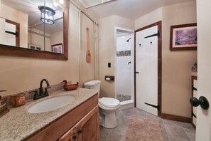 Shower, hair dryer, towels, toilet paper