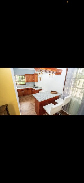 Fridge, oven, coffee/tea maker, dining tables