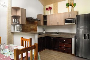 Fridge, microwave, stovetop, coffee/tea maker