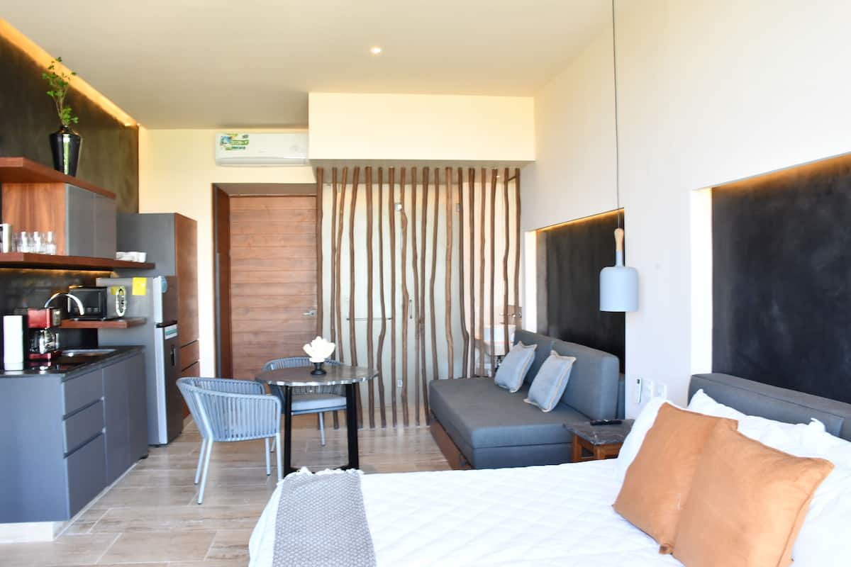 Luxury Suite, 1 King Bed with Sofa bed, Balcony, Partial Ocean View | 2 bedrooms, in-room safe, blackout drapes, iron/ironing board