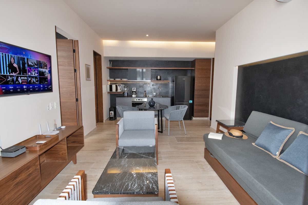 Deluxe Apartment, 1 Bedroom, Balcony | Living area | 42-inch flat-screen TV with cable channels, TV